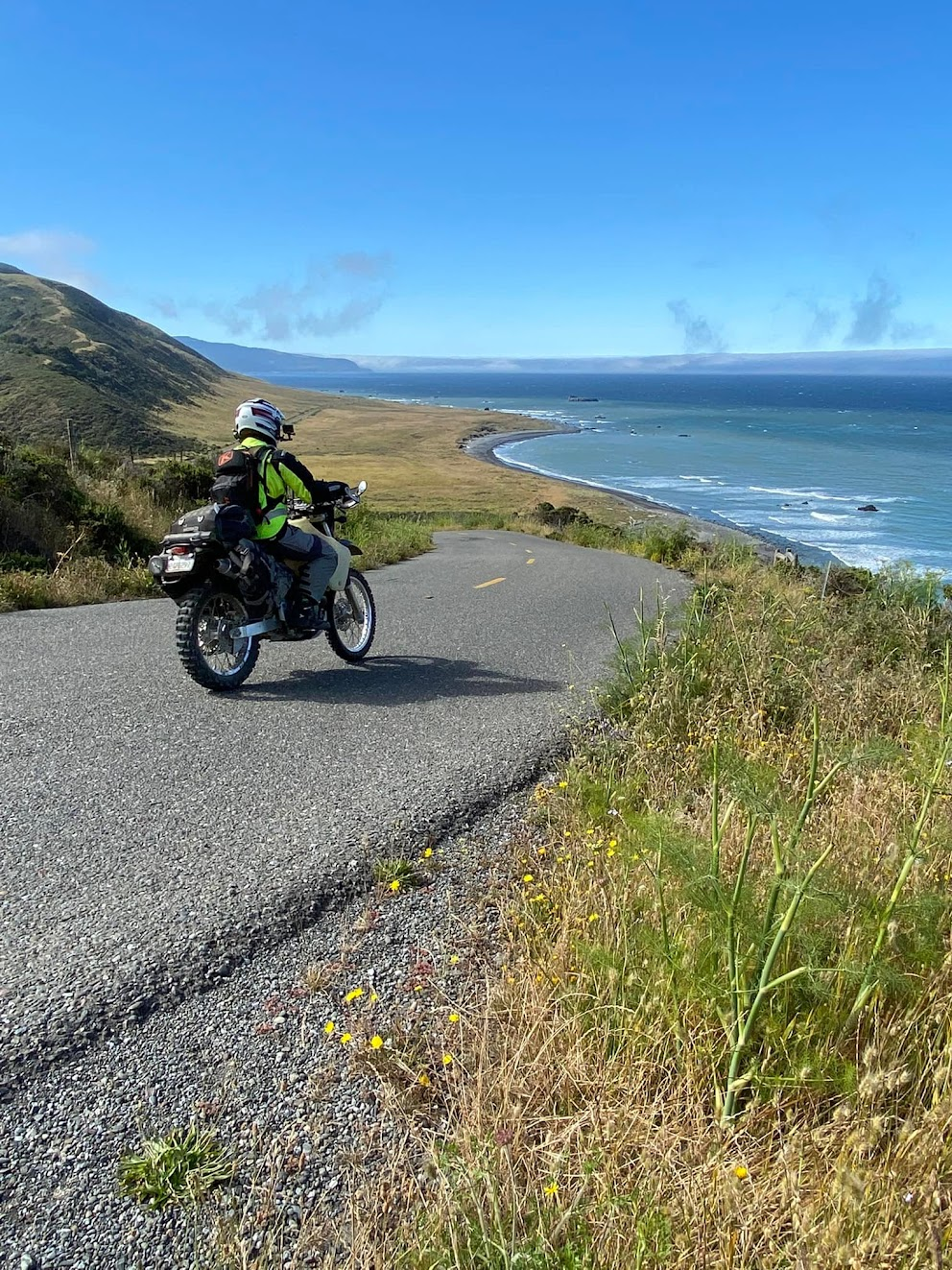 Motorcyclist riding a coastal road